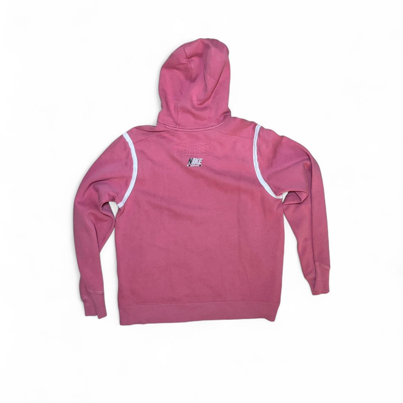 Retro vibes with this vintage Nike hoodie in a faded pink/red tone