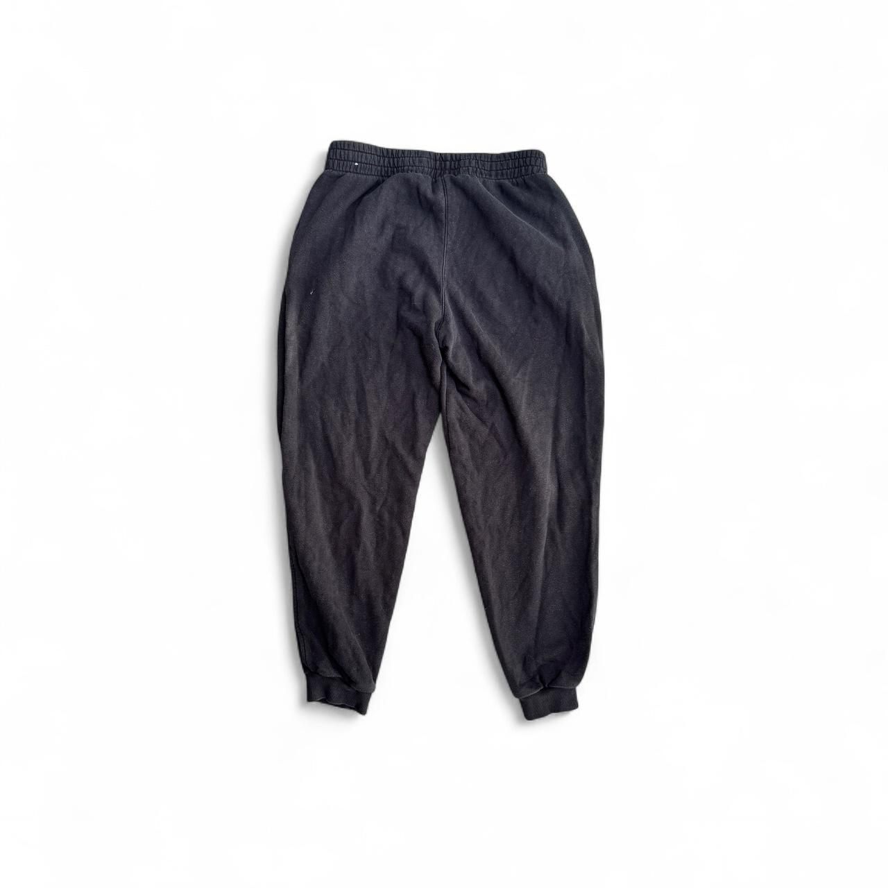 Black Nike sweatpants with embroidered logo