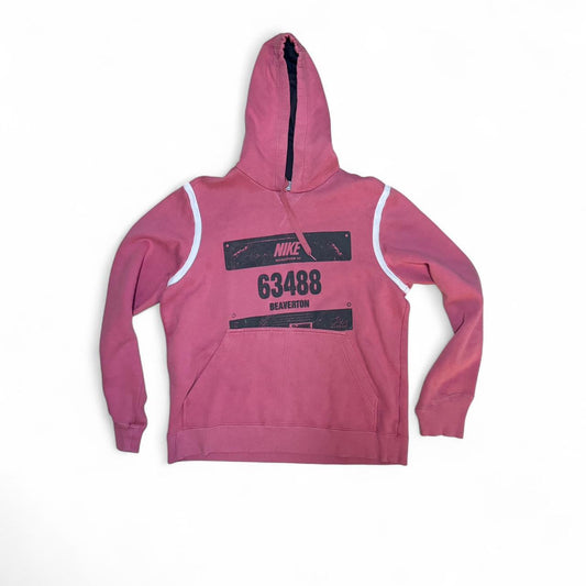 Retro vibes with this vintage Nike hoodie in a faded pink/red tone