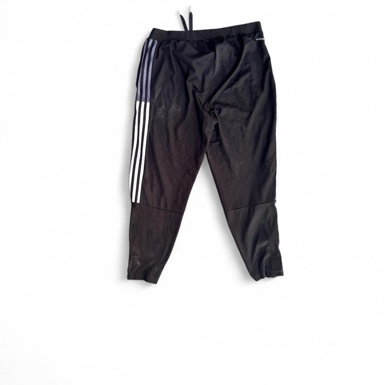 Black Adidas Primegreen joggers with white stripes