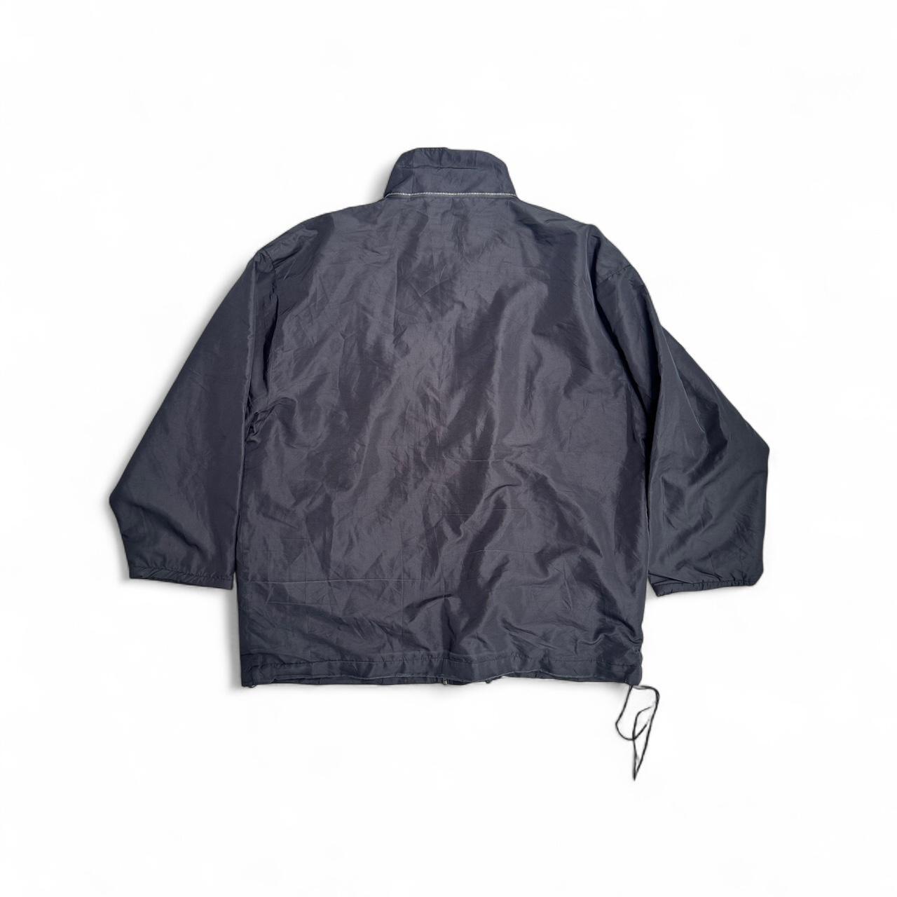 Black Kappa windbreaker jacket with white fleece lining which is reversible to a