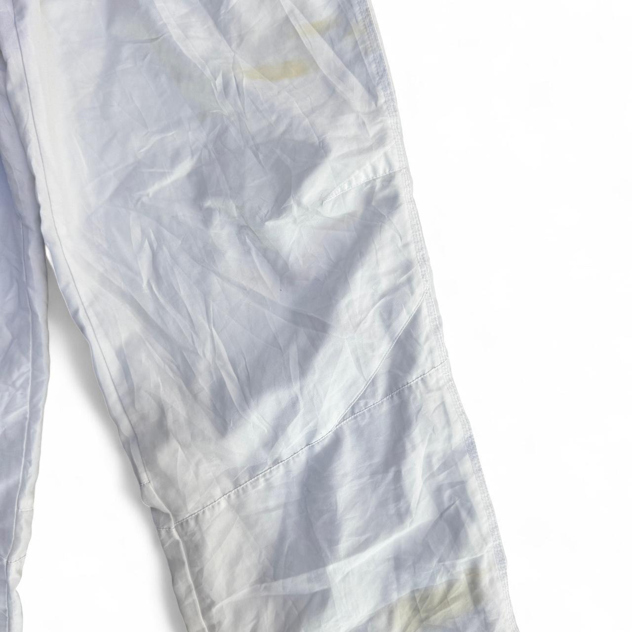 White Puma track pants with embroidered logo and drawstring waist