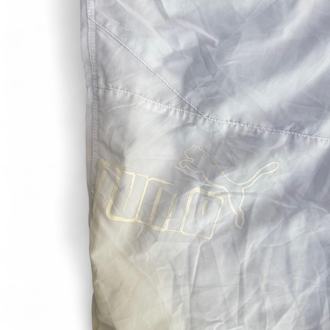 White Puma track pants with embroidered logo and drawstring waist