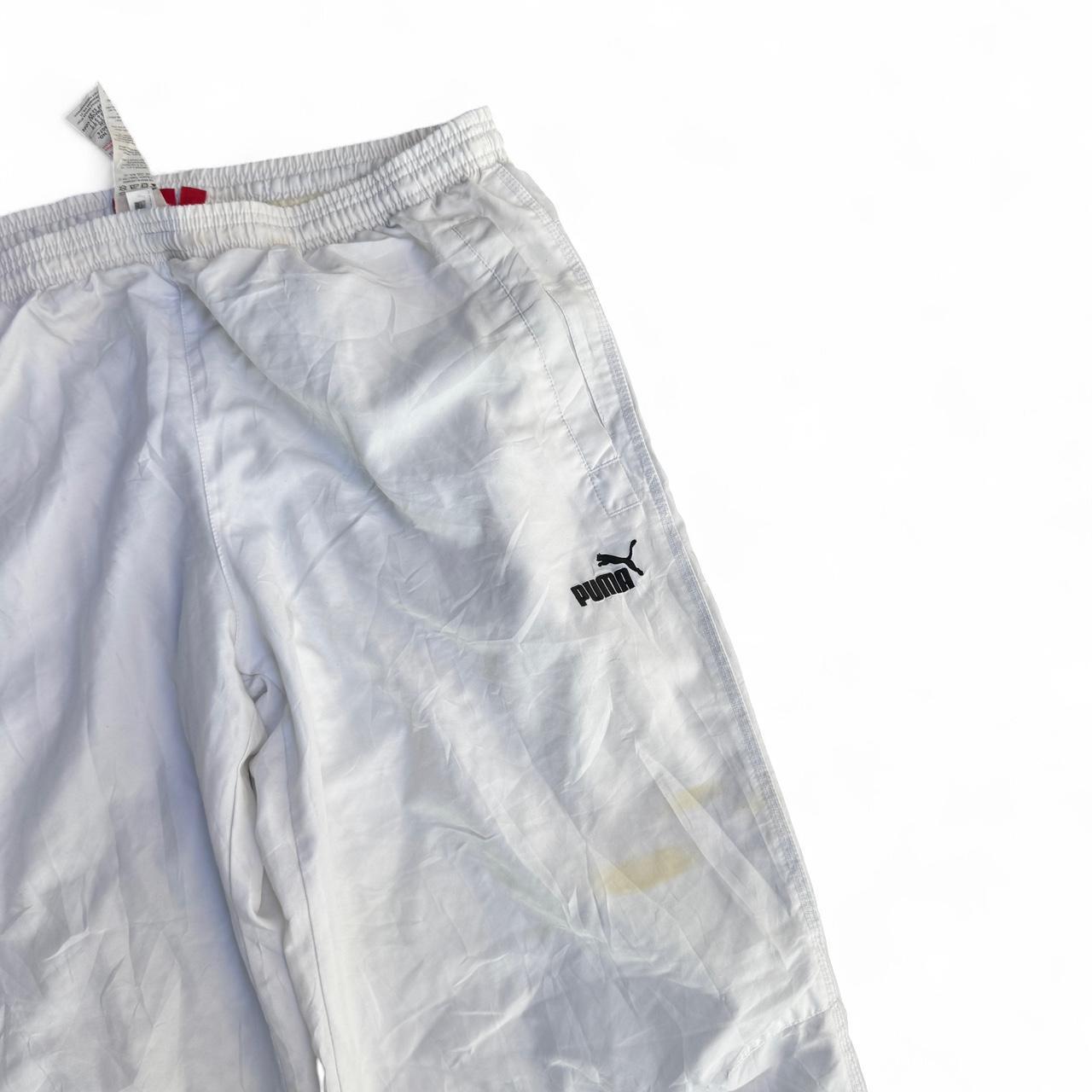 White Puma track pants with embroidered logo and drawstring waist