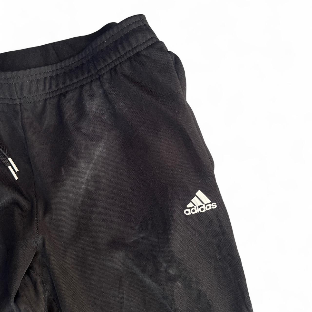 Black Adidas Primegreen joggers with white stripes
