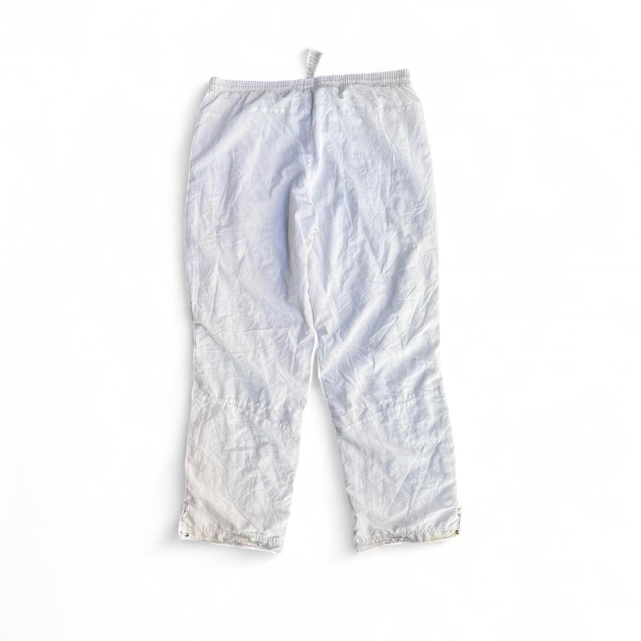 White Puma track pants with embroidered logo and drawstring waist