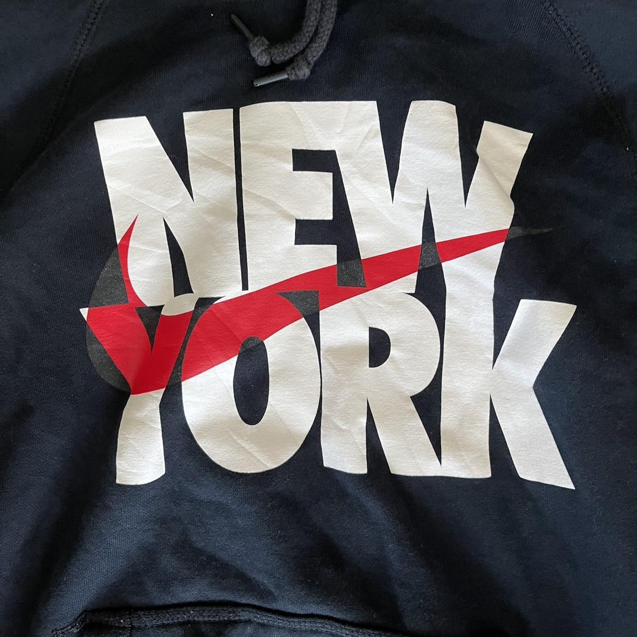 Black Nike hoodie in size Small featuring a bold New York graphic on the front