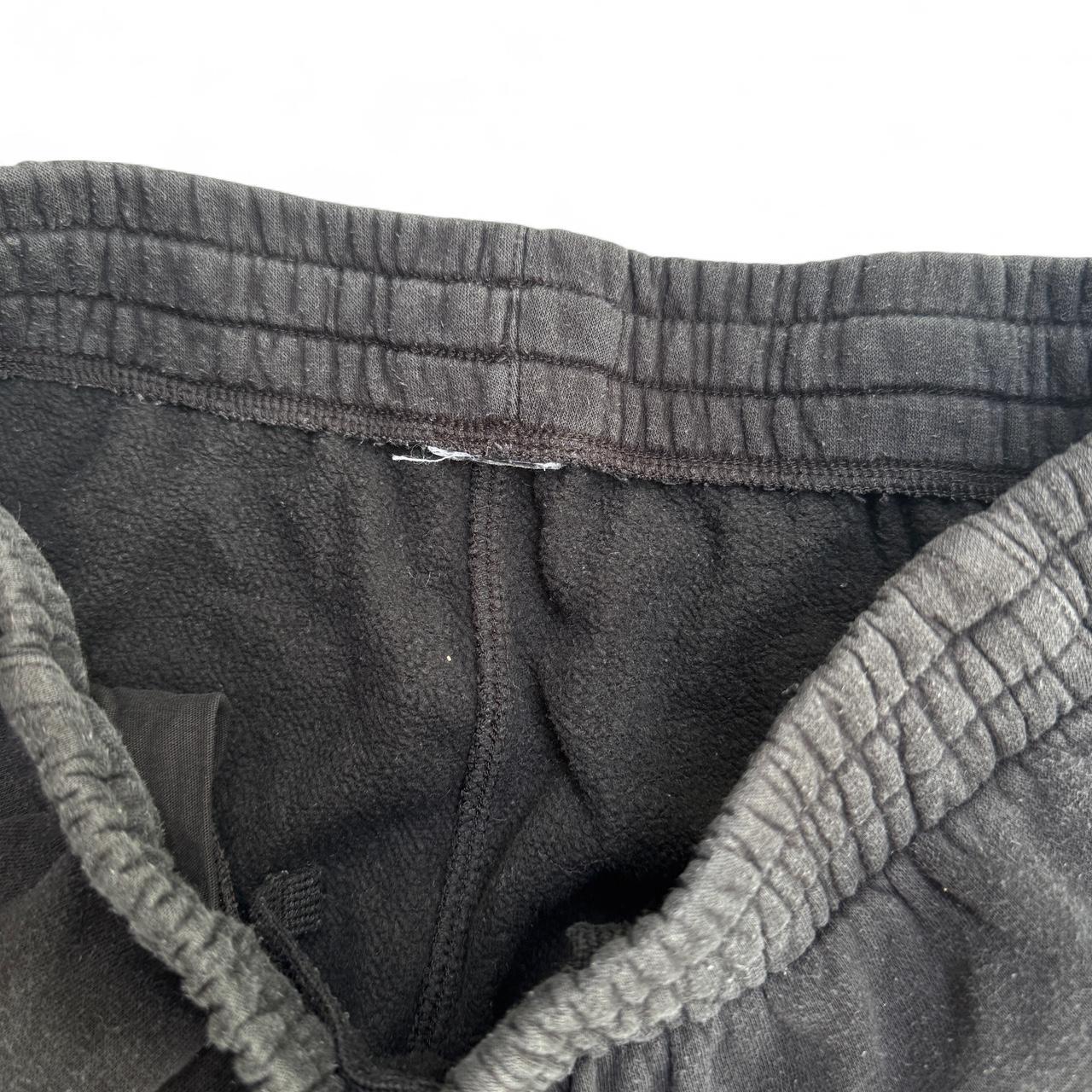 Black Nike sweatpants with embroidered logo