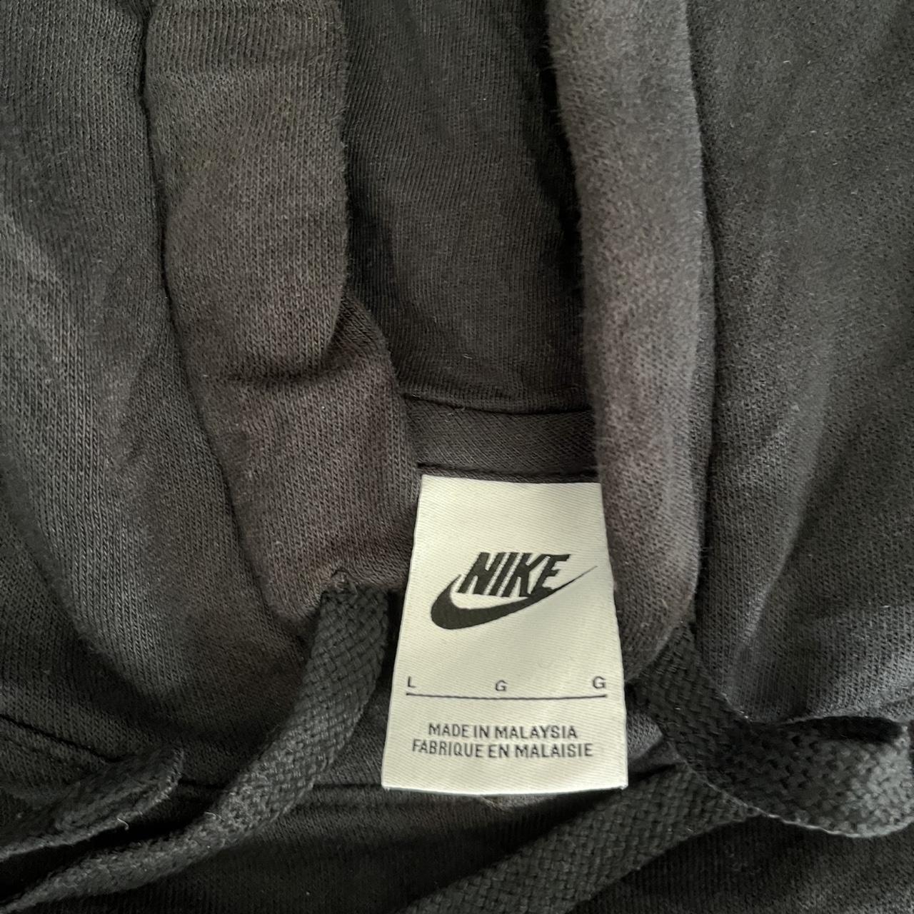 Black Nike hoodie in size Large featuring a Tualatin Football graphic on the front