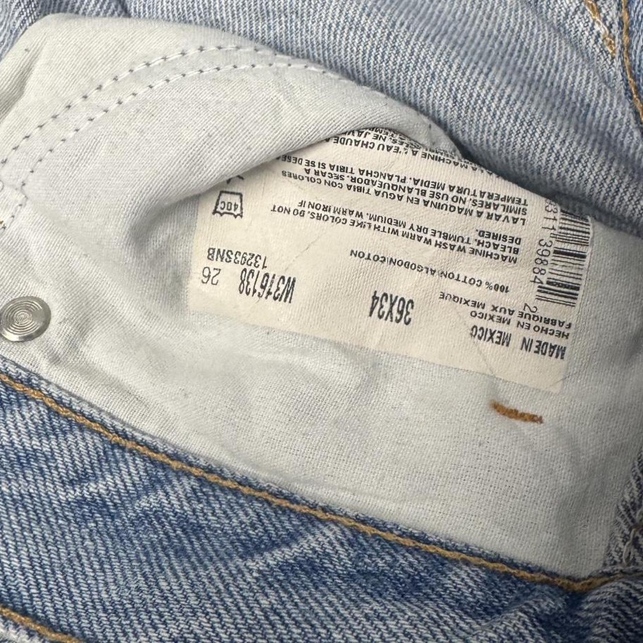 Blue Dickies jeans in size 36x34 with lots of marks and clear signs of wear