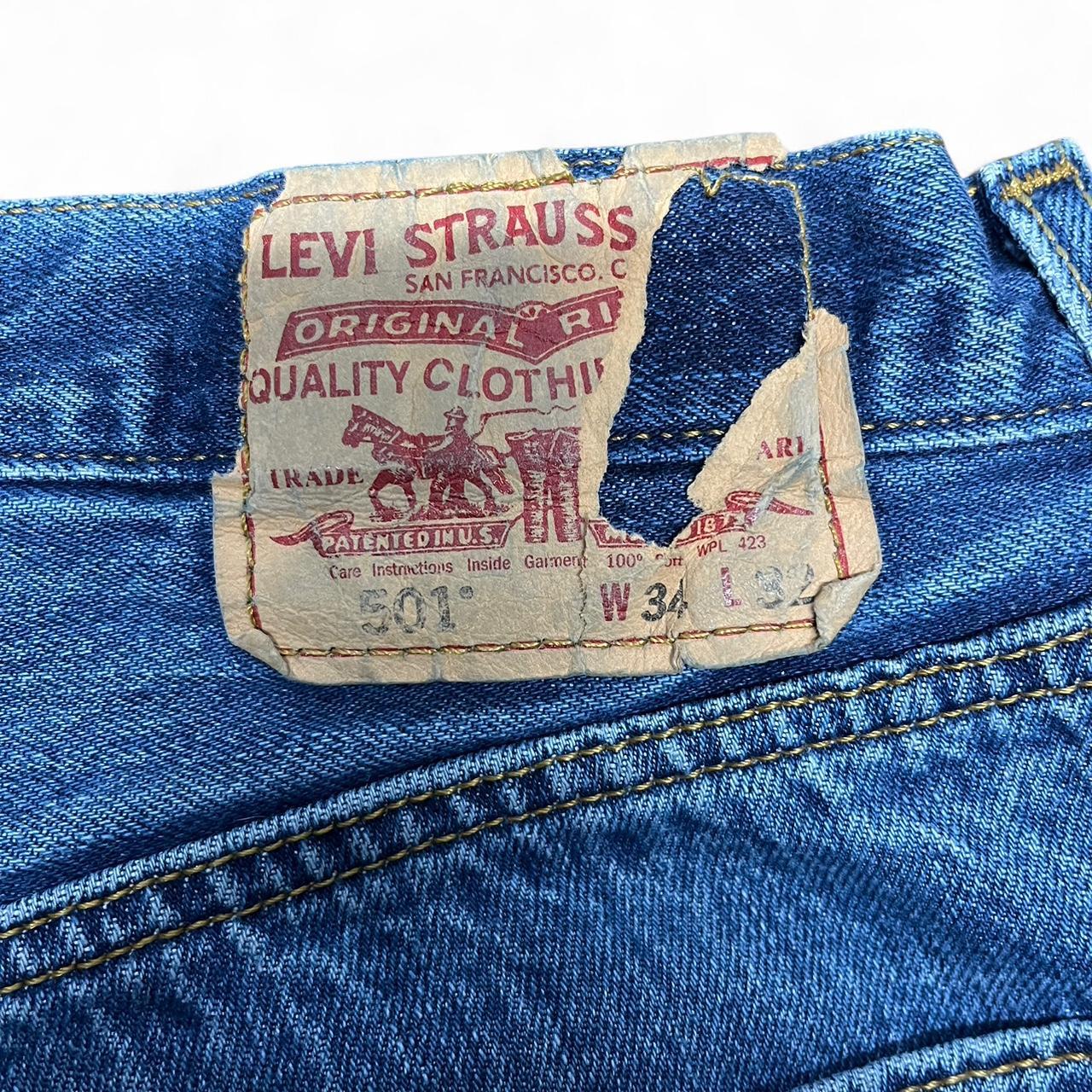 Vintage Levi’s 501 Jeans – W34 L32 – Mid Wash – Distressed Patch Tag