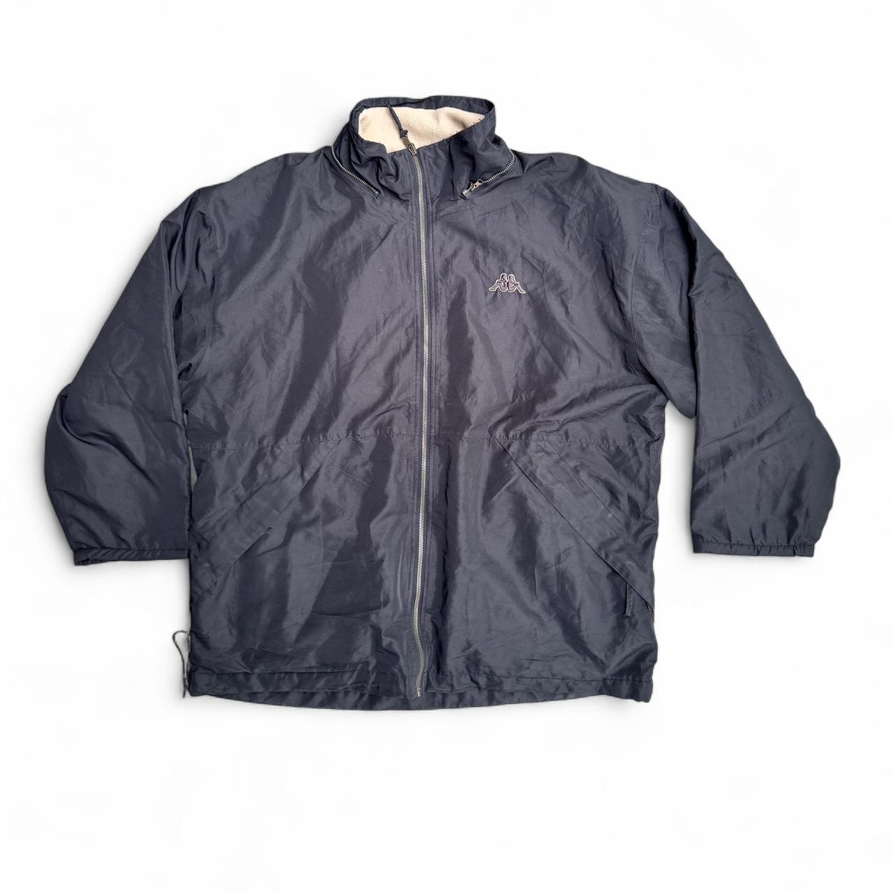 Black Kappa windbreaker jacket with white fleece lining which is reversible to a